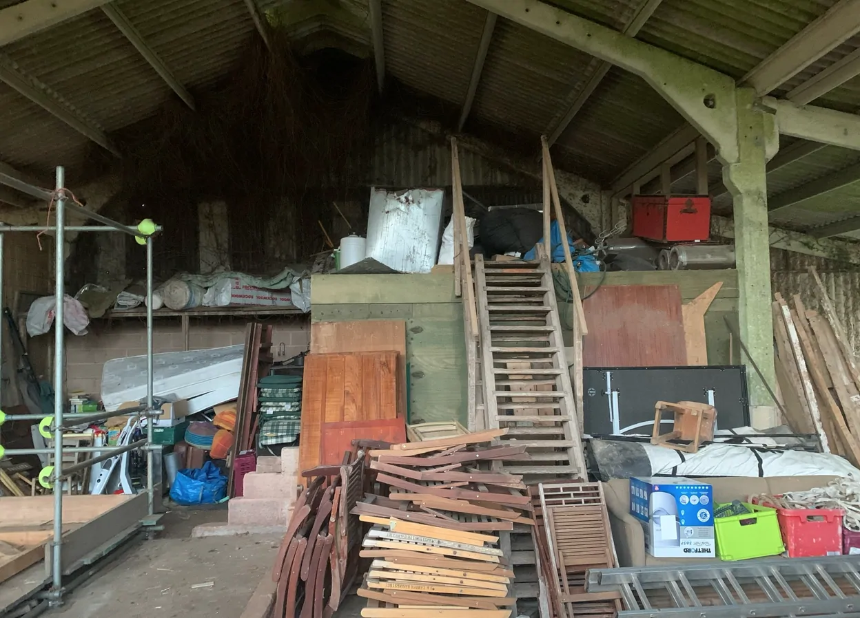 The barn before the work, bare and unfinished